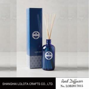 China transparent blue color reed diffuser with natural stick and pattern folding box wholesale